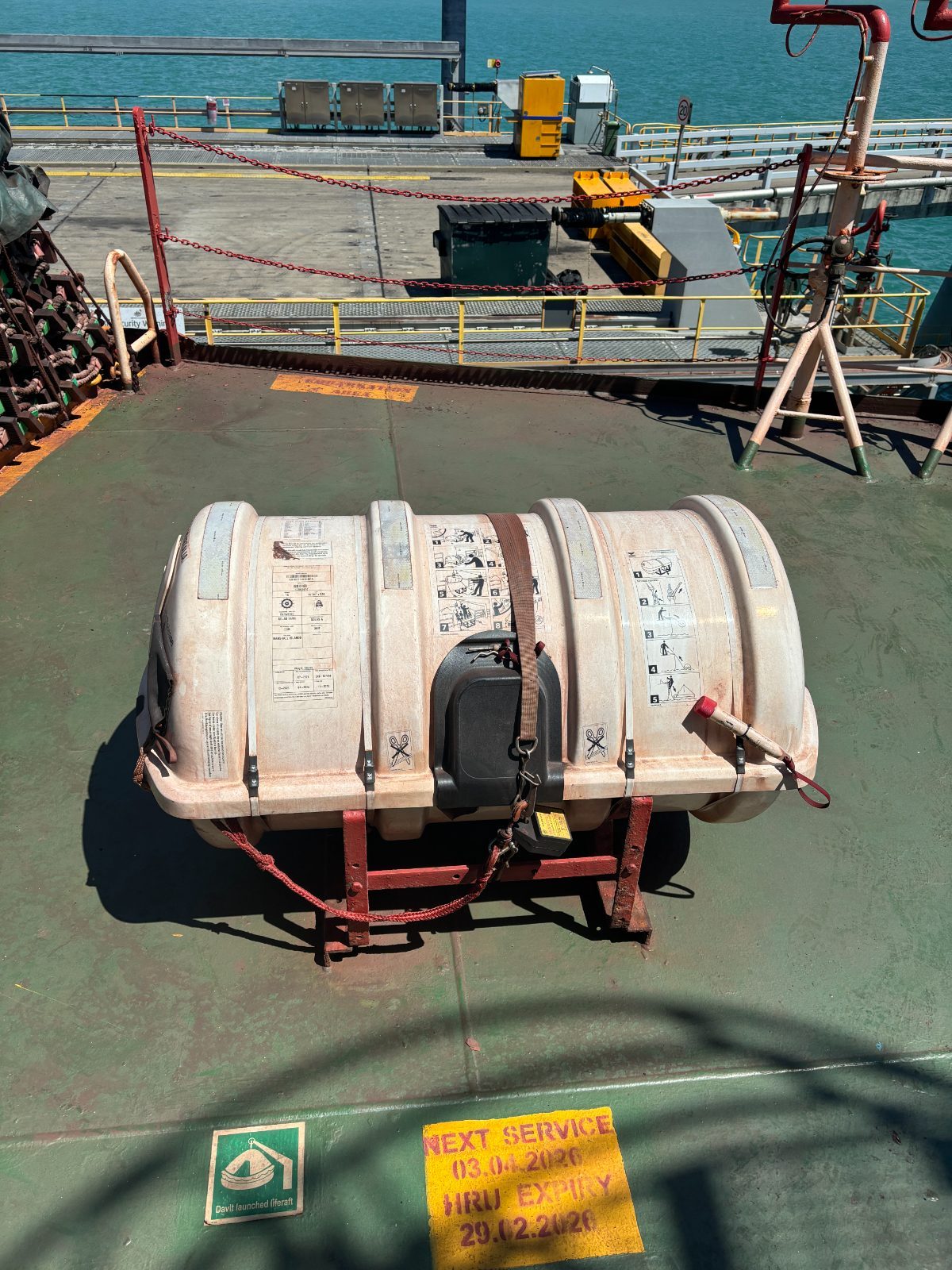 Davit launched liferaft with service and HRU expiry dates stencilled on deck